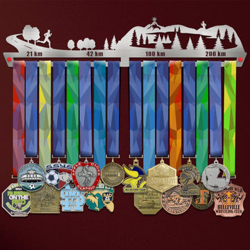21KM 42KM 100KM 200KM Medal Hanger holding a full row of medals on a wall