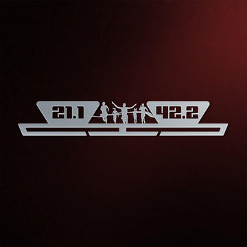 21.1 42.2 Medal Hanger in laser-cut steel on a dark background