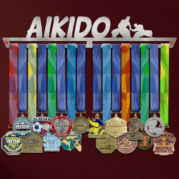 Aikido Medal Hanger holding a full row of medals on a wall