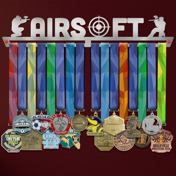 Airsoft Medal Hanger holding a full row of medals on a wall