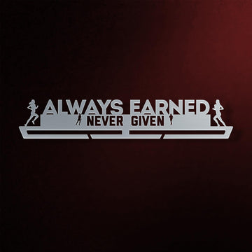 Women's Always Earned Never Given Medal Hanger in laser-cut steel on a dark background