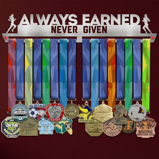 Women's Always Earned Never Given Medal Hanger holding a full row of medals on a wall