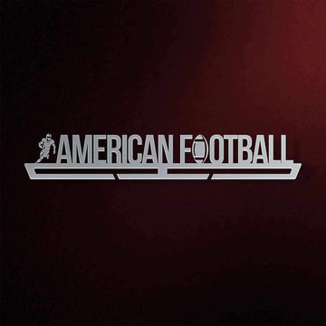 American Football Medal Hanger in laser-cut steel on a dark background