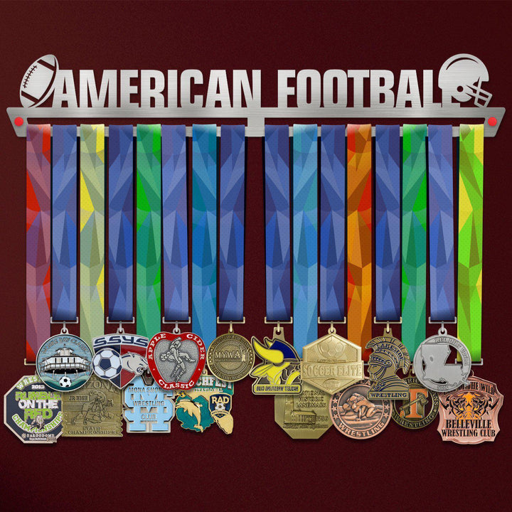American Football Medal Hanger holding a full row of medals on a wall