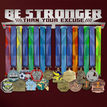 Be Stronger Than Your Excuse Medal Hanger holding a full row of medals on a wall