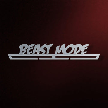 Beast Mode Medal Hanger in laser-cut steel on a dark background