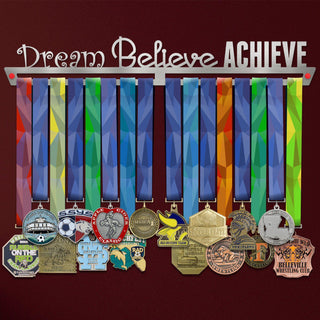 Dream Believe Achieve Medal Hanger holding a full row of medals on a wall