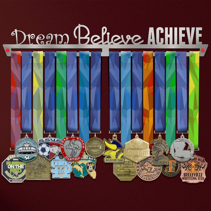 Dream Believe Achieve Medal Hanger holding a full row of medals on a wall