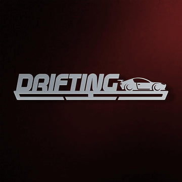 Drifting Medal Hanger in laser-cut steel on a dark background