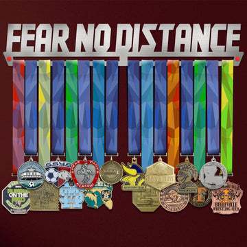 Fear No Distance Medal Hanger holding a full row of medals on a wall