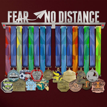 Fear No Distance Medal Hanger V2 holding a full row of medals on a wall