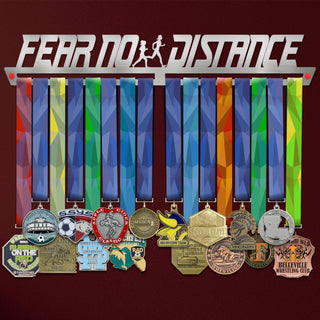 Women's Fear No Distance Medal Hanger holding a full row of medals on a wall