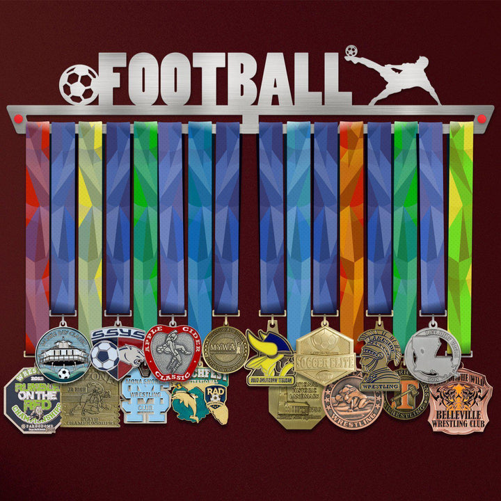 Football Medal Hanger V2 holding a full row of medals on a wall