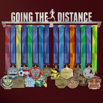 Women's Going The Distance Medal Hanger holding a full row of medals on a wall