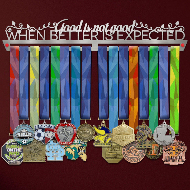 Good Is Not Good Medal Hanger holding a full row of medals on a wall