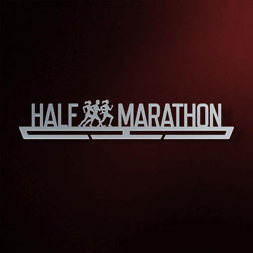 Half Marathon Medal Hanger in laser-cut steel on a dark background