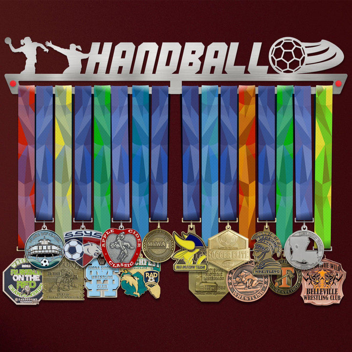 Women's Handball Medal Hanger holding a full row of medals on a wall