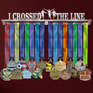 I Crossed The Line Medal Hanger holding a full row of medals on a wall