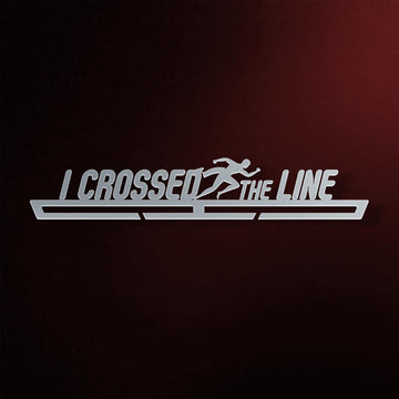I Crossed The Line Medal Hanger V2 in laser-cut steel on a dark background