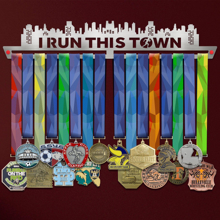 I Run This Town Medal Hanger holding a full row of medals on a wall