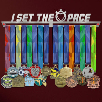 I Set The Pace Medal Hanger holding a full row of medals on a wall