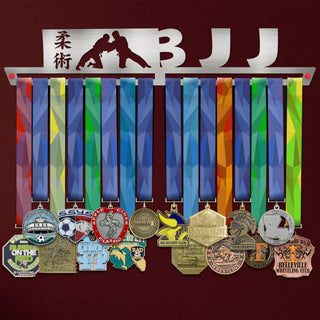 BJJ Jiu-Jitsu Medal Hanger holding a full row of medals on a wall