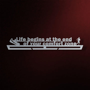 Comfort Zone Medal Hanger in laser-cut steel on a dark background