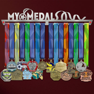 My Medals Medal Hanger holding a full row of medals on a wall