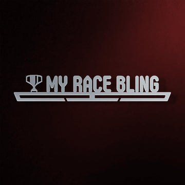 My Race Bling Medal Hanger in laser-cut steel on a dark background