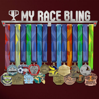My Race Bling Medal Hanger holding a full row of medals on a wall