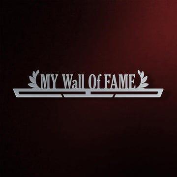 My Wall Of Fame Medal Hanger in laser-cut steel on a dark background