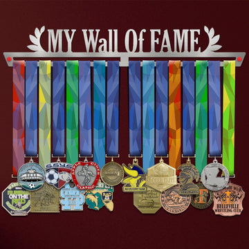 My Wall Of Fame Medal Hanger holding a full row of medals on a wall