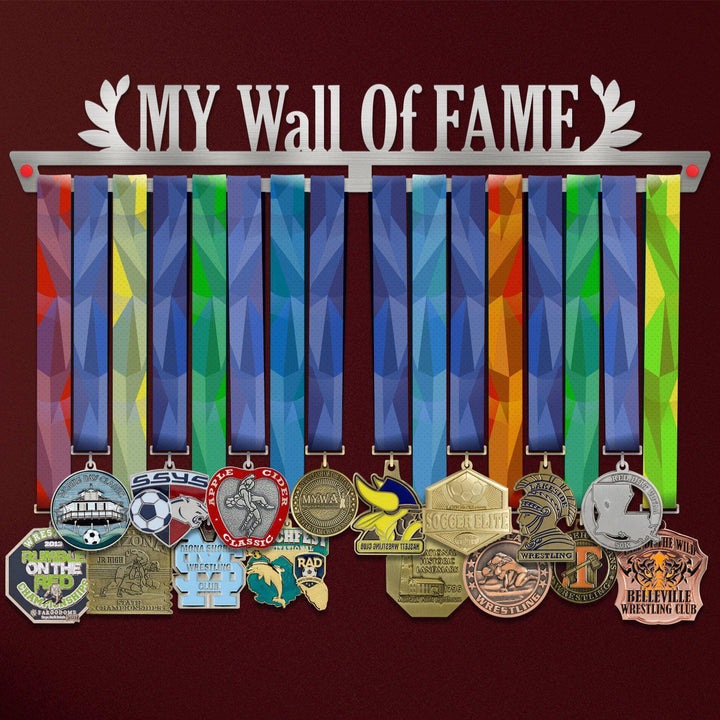 My Wall Of Fame Medal Hanger holding a full row of medals on a wall