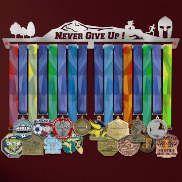 Never Give Up Trailscape Medal Hanger holding a full row of medals on a wall