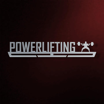 Powerlifting Medal Hanger in laser-cut steel on a dark background