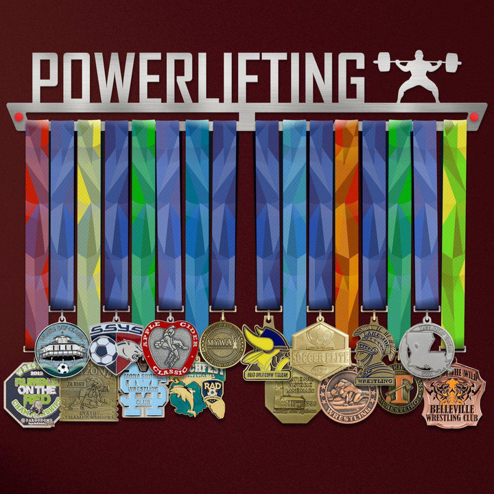 Powerlifting Medal Hanger holding a full row of medals on a wall