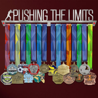 Pushing The Limits Medal Hanger V2 holding a full row of medals on a wall