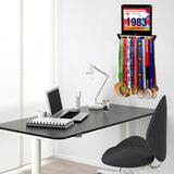 Race Bib Holder + Medal Hanger Display Rack V1 mounted in a modern office space, displaying colorful medals and a race bib.