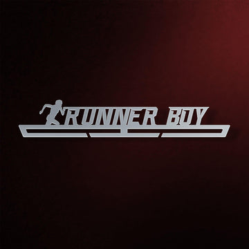 Runner Boy Medal Hanger in laser-cut steel on a dark background
