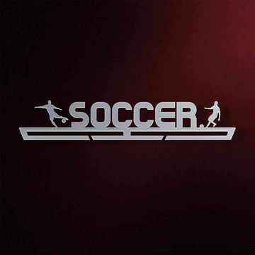 Soccer Medal Hanger in laser-cut steel on a dark background