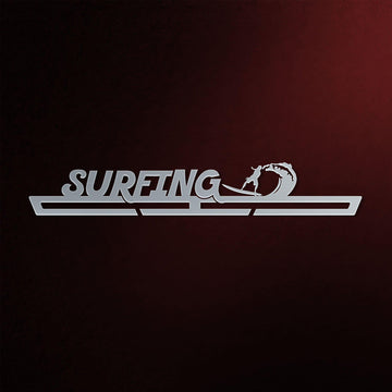 Surfing Medal Hanger in laser-cut steel on a dark background