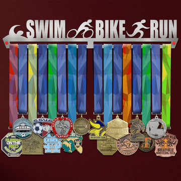 Swim Bike Run Medal Hanger holding a full row of medals on a wall