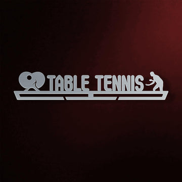 Table Tennis Medal Hanger in laser-cut steel on a dark background