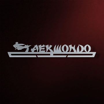 Taekwondo Medal Hanger in laser-cut steel on a dark background
