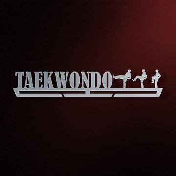 Taekwondo Medal Hanger in laser-cut steel on a dark background
