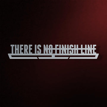 There Is No Finish Line Medal Hanger in laser-cut steel on a dark background