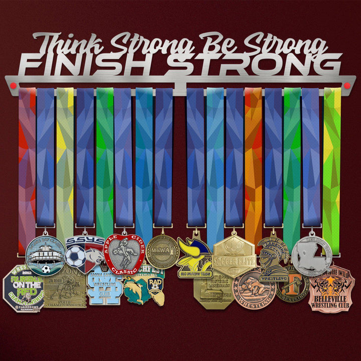 Finish Strong Medal Hanger holding a full row of medals on a wall