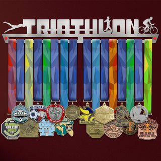 Triathlon Medal Hanger holding a full row of medals on a wall