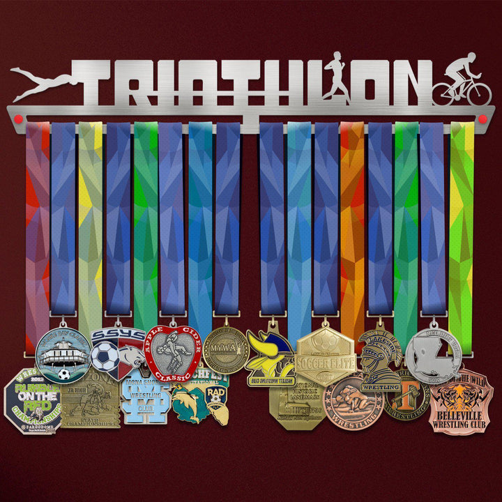 Triathlon Medal Hanger holding a full row of medals on a wall