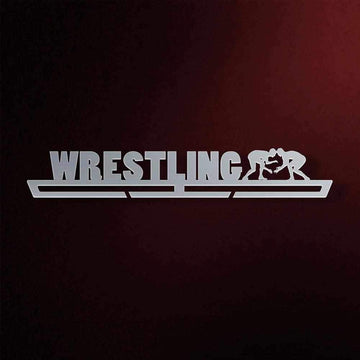 Wrestling Medal Hanger in laser-cut steel on a dark background
